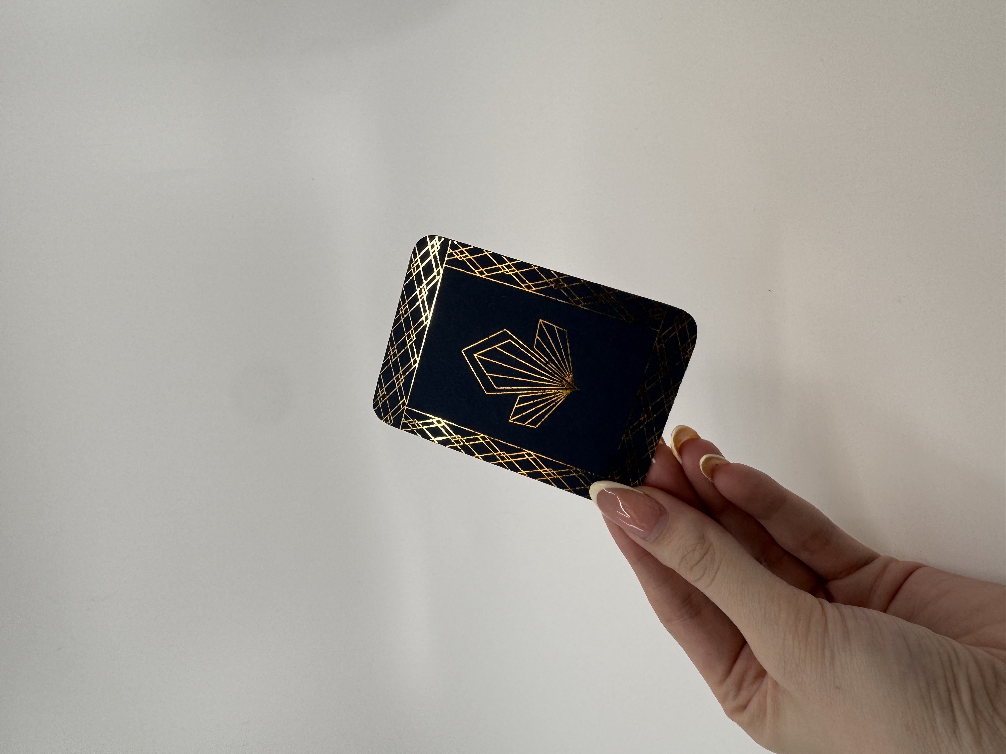 Playing card with gold detailing